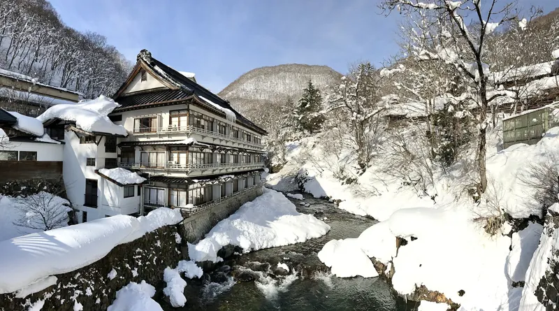 Osenkaku, a riverside inn in Minakami (photo of the Minakami area, not of this property)